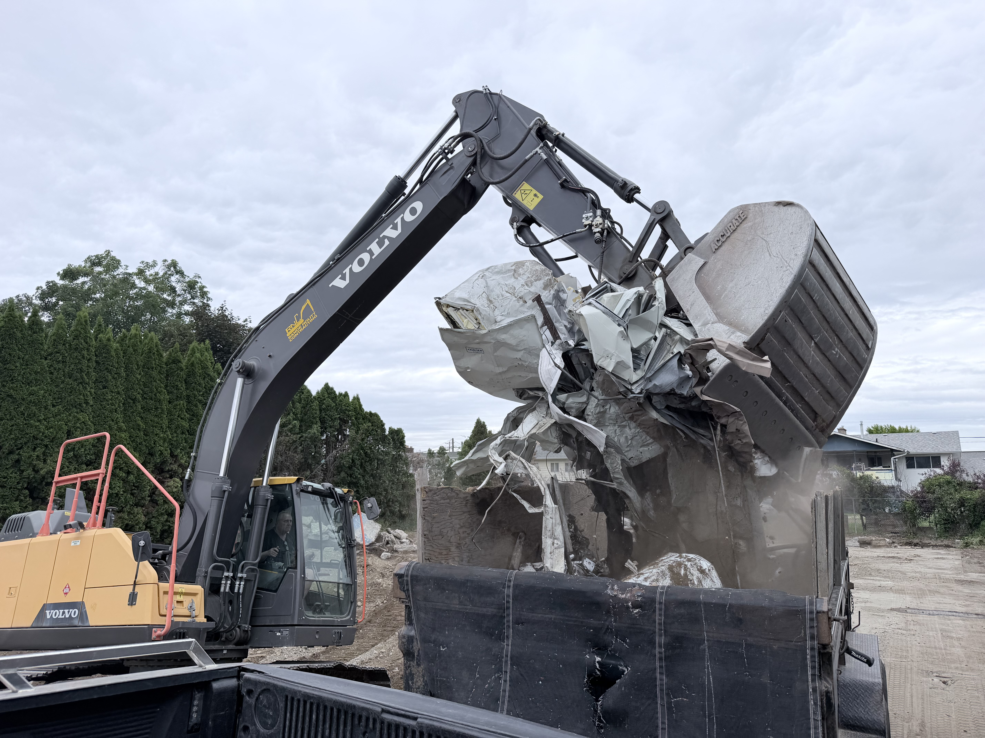 Clear Vision Maintenance excavator on a commercial demolition site in Kelowna BC